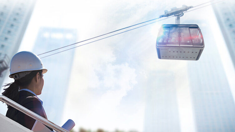 Cable car and a woman wearing a hard hat